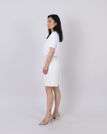 Side view of the white cotton logo T-shirt styled with white shorts